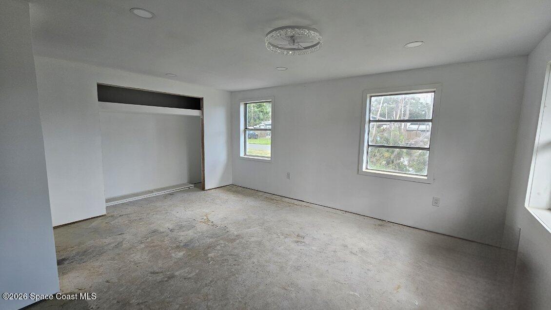 1925 Monticello Avenue Merritt Island, FL 32952 - Photo 10 of 17 an empty room with windows