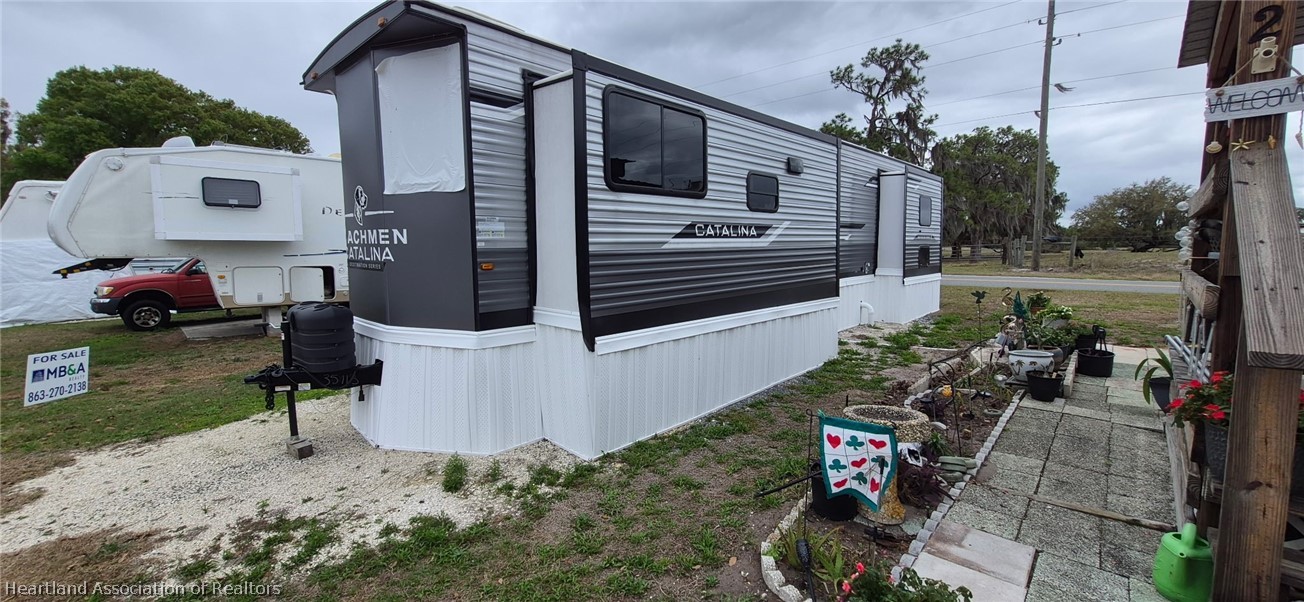 1621 South Lake Reedy Boulevard Frostproof, FL 33843 - Photo 1 of 15 a view of a house with backyard and sitting area