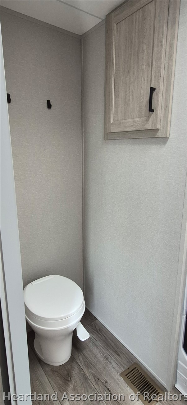 1621 South Lake Reedy Boulevard Frostproof, FL 33843 - Photo 13 of 15 a white toilet sitting next to a small window