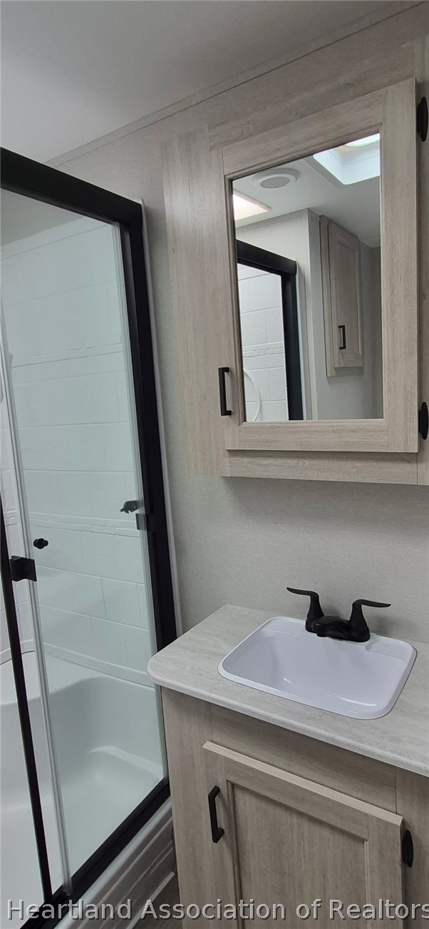 1621 South Lake Reedy Boulevard Frostproof, FL 33843 - Photo 8 of 15 a bathroom with a sink and mirror