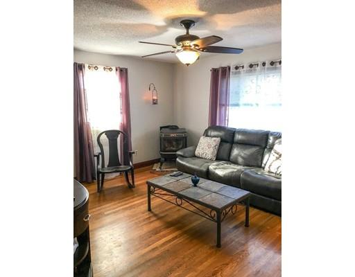 103 Chicago Street Fall River, MA 02721 - Photo 13 of 39 a living room with furniture and a chandelier
