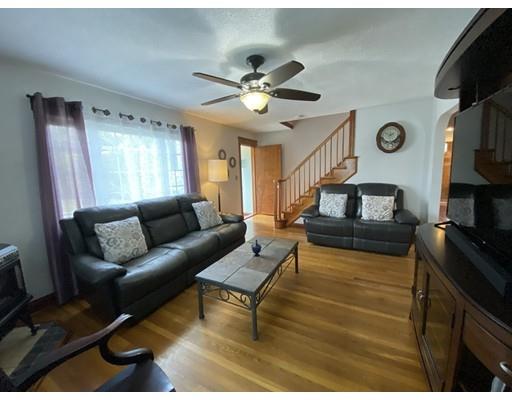 103 Chicago Street Fall River, MA 02721 - Photo 15 of 39 a living room with furniture and a flat screen tv