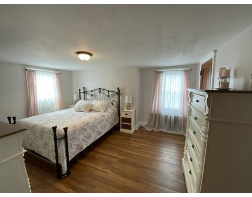 103 Chicago Street Fall River, MA 02721 - Photo 22 of 39 a spacious bedroom with a bed and a window