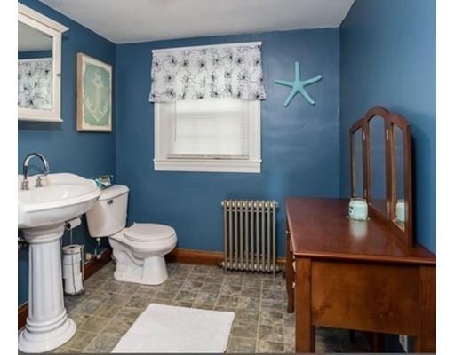 103 Chicago Street Fall River, MA 02721 - Photo 23 of 39 a bathroom with a toilet a sink and a mirror