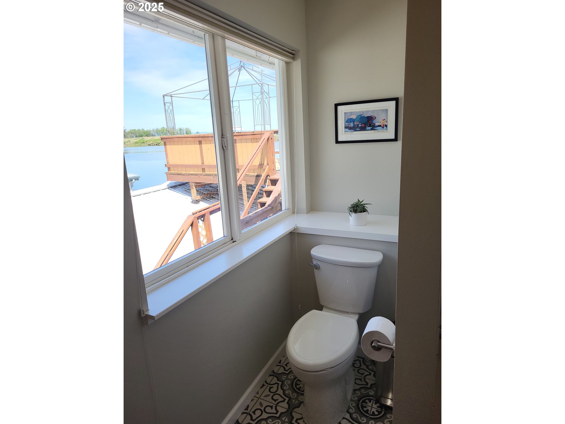 23538 Northwest St Helens Road, Unit S5 Portland, OR 97231 - Photo 25 of 48 a white toilet sitting next to a window