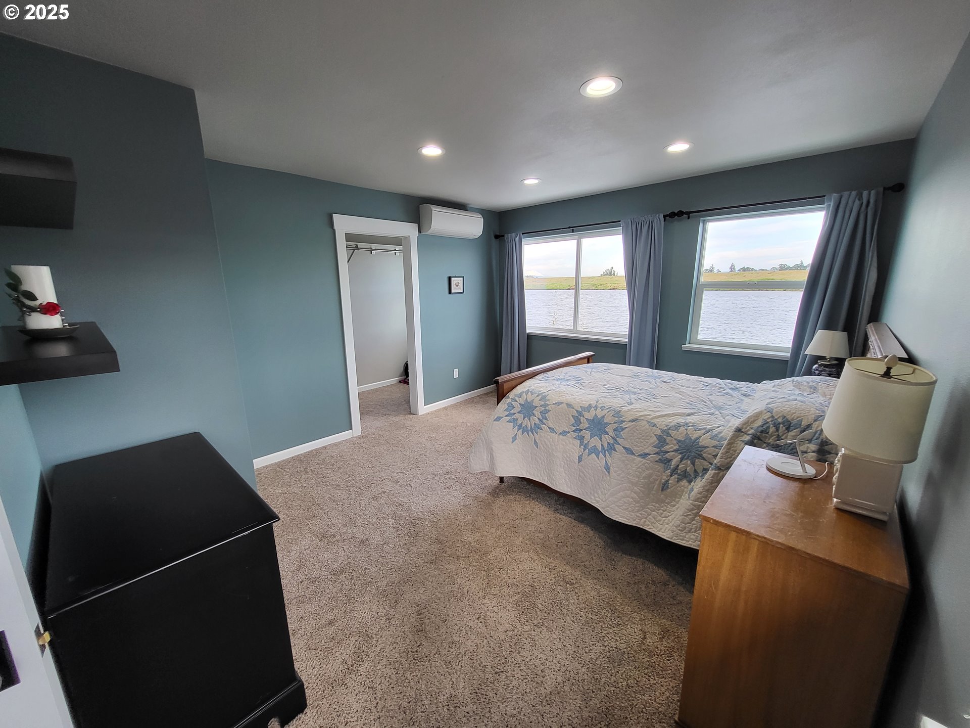 23538 Northwest St Helens Road, Unit S5 Portland, OR 97231 - Photo 26 of 48 a bedroom with a bed and a window