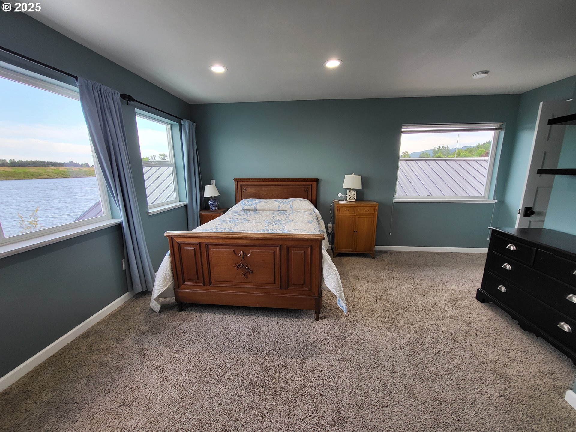 23538 Northwest St Helens Road, Unit S5 Portland, OR 97231 - Photo 30 of 48 a bedroom with bed and window