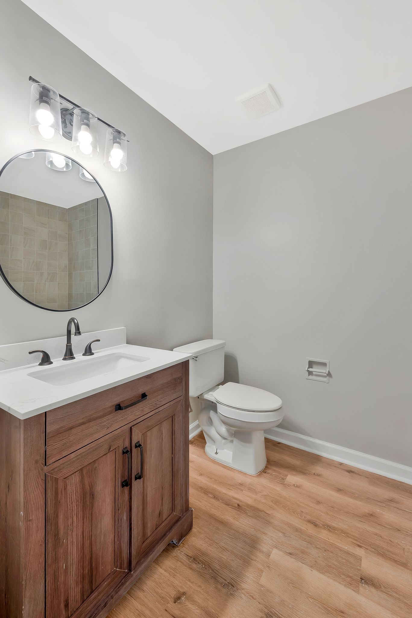 213 Manzano Road Madison, TN 37115 - Photo 12 of 24 a bathroom with a toilet a sink and mirror