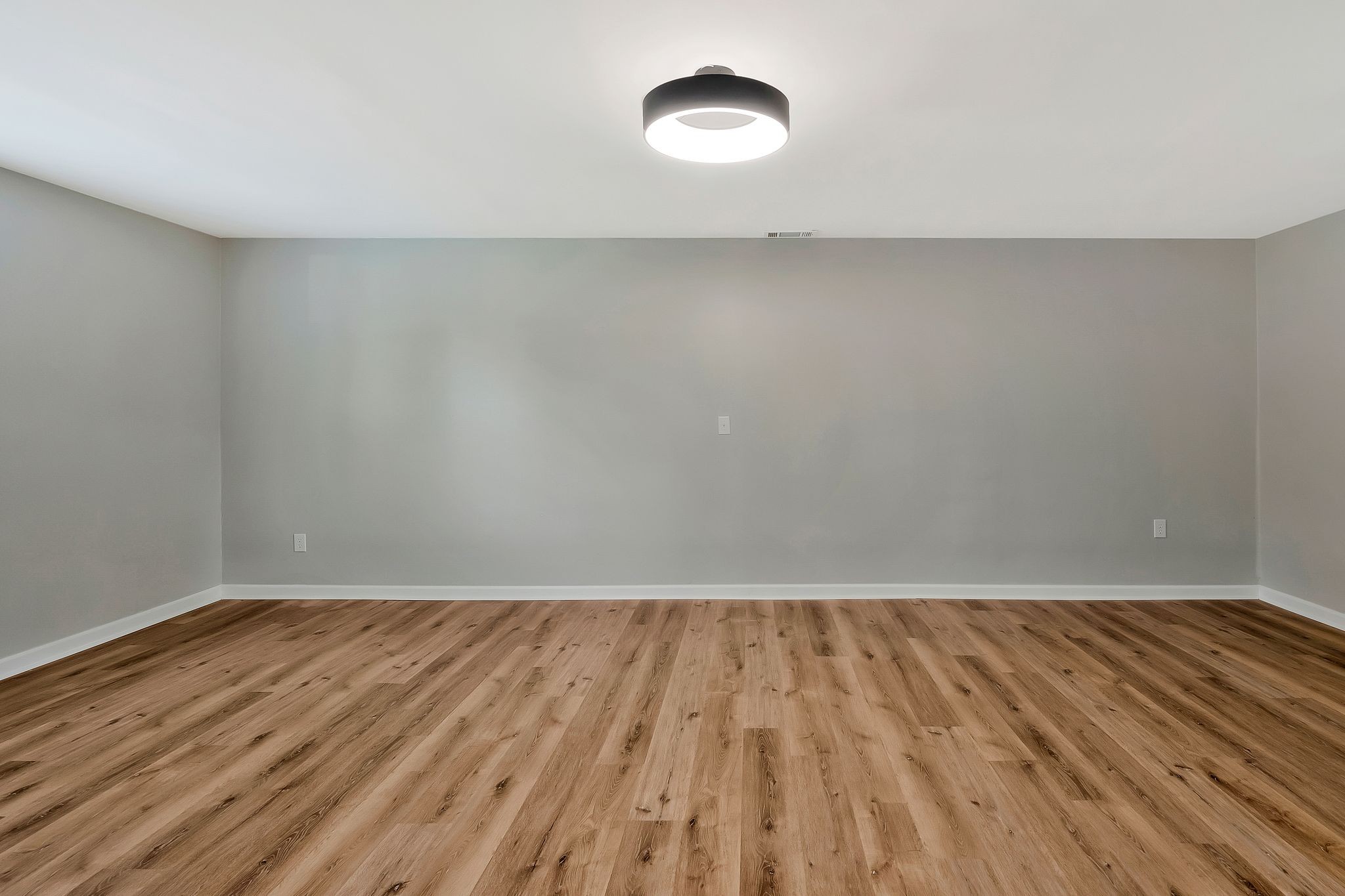 213 Manzano Road Madison, TN 37115 - Photo 8 of 24 a view of an empty room with wooden floor