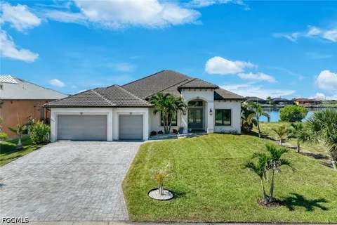 a front view of a house with yard