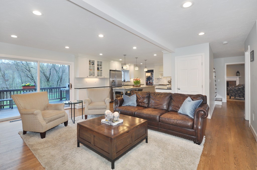 23 Wright Farm, Unit 23 Concord, MA 01742 - Photo 14 of 30 a living room with furniture and a view of kitchen