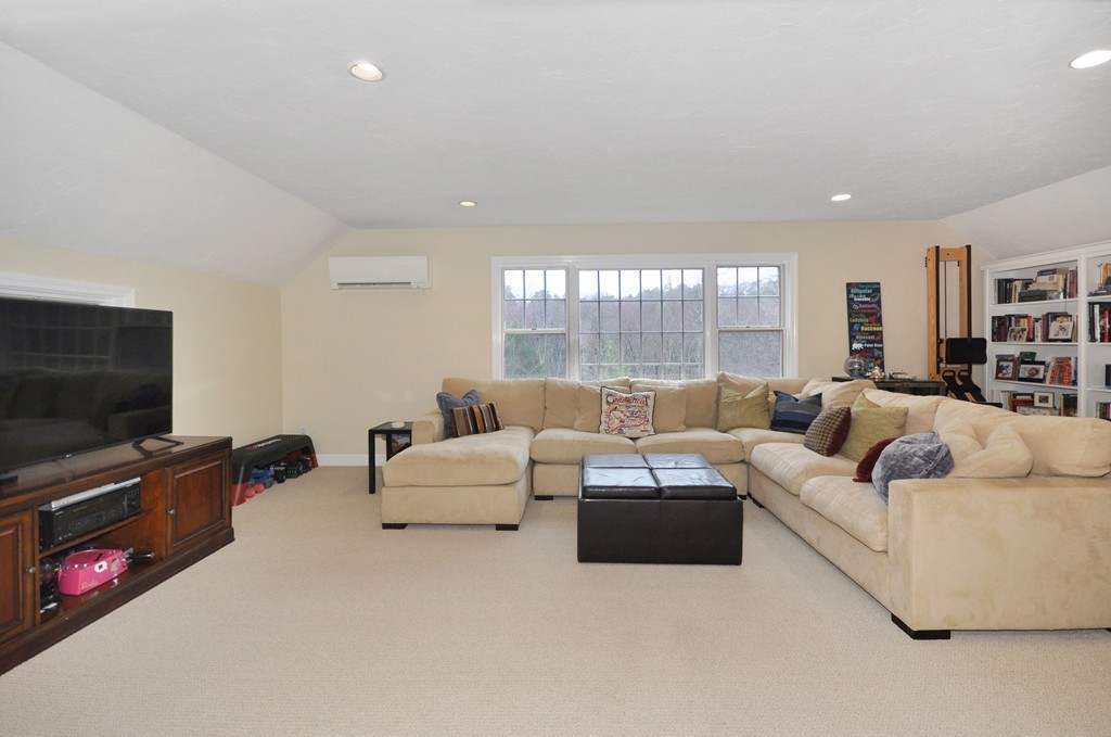 23 Wright Farm, Unit 23 Concord, MA 01742 - Photo 18 of 30 a living room with furniture and a flat screen tv
