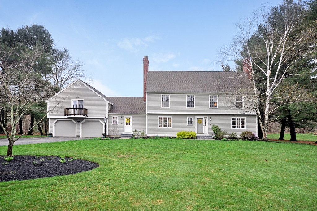 23 Wright Farm, Unit 23 Concord, MA 01742 - Photo 2 of 30 a view of a house with a big yard and large trees