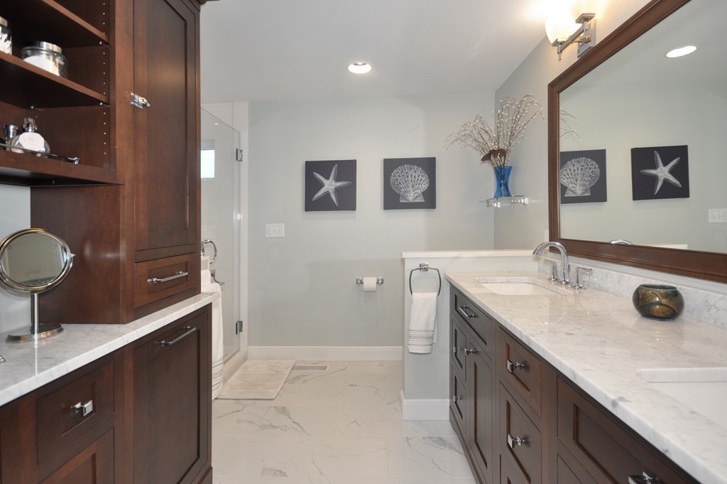 23 Wright Farm, Unit 23 Concord, MA 01742 - Photo 21 of 30 a spacious bathroom with a granite countertop sink and a mirror