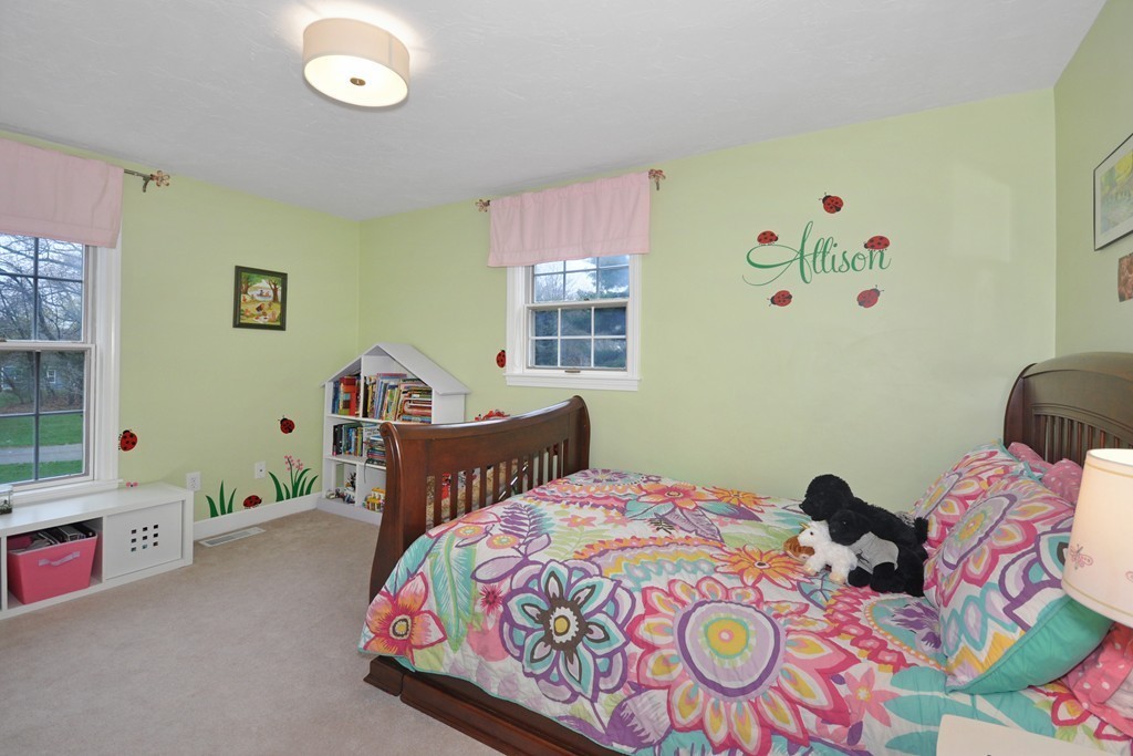 23 Wright Farm, Unit 23 Concord, MA 01742 - Photo 25 of 30 a bedroom with a bed and a window