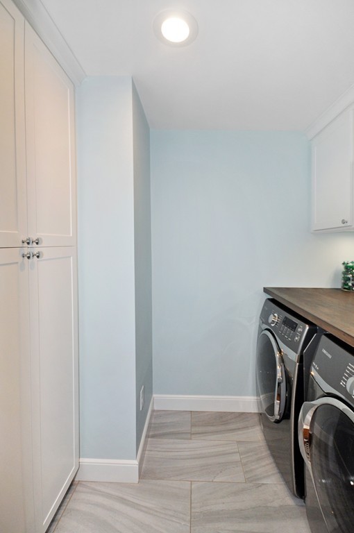 23 Wright Farm, Unit 23 Concord, MA 01742 - Photo 27 of 30 a view of storage and utility room with washer and dryer