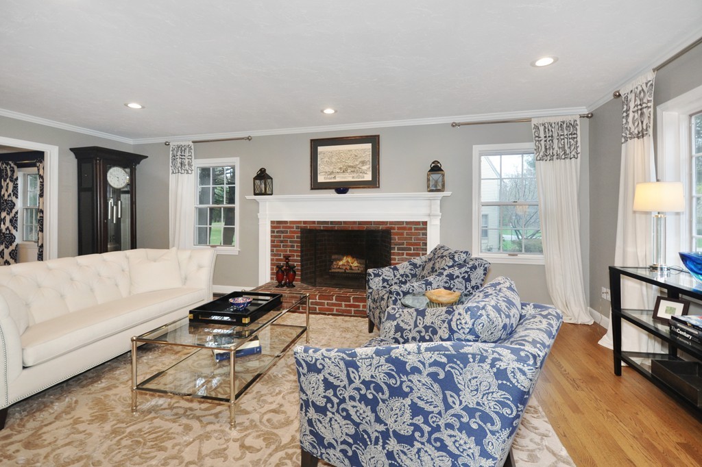 23 Wright Farm, Unit 23 Concord, MA 01742 - Photo 5 of 30 a living room with furniture and a fireplace