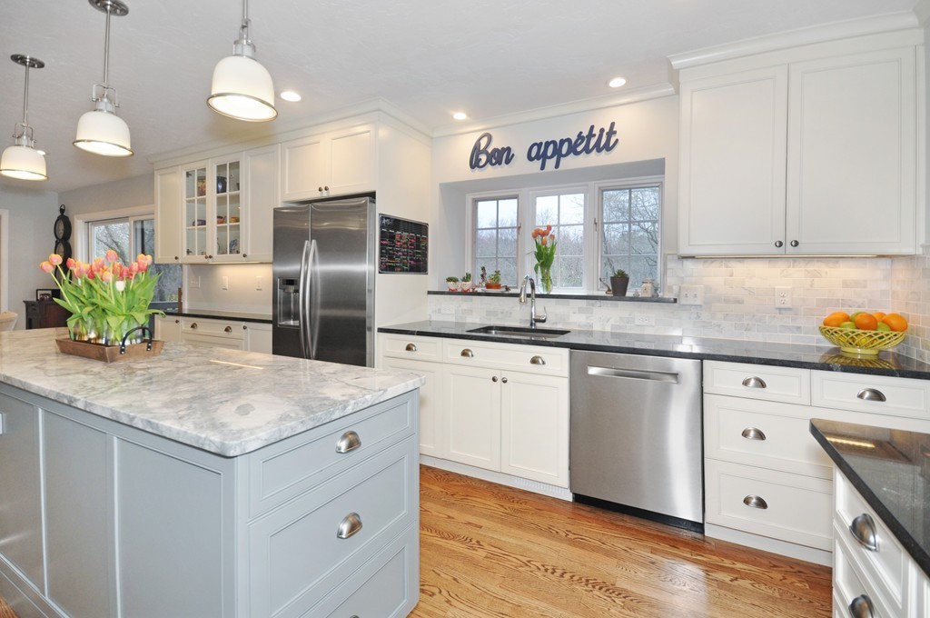 23 Wright Farm, Unit 23 Concord, MA 01742 - Photo 8 of 30 a kitchen with stainless steel appliances granite countertop a sink refrigerator and cabinets