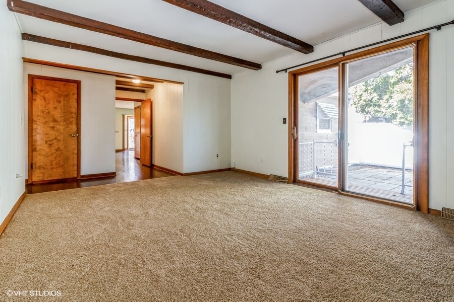 195 Ridge Avenue Crystal Lake, IL 60014 - Photo 5 of 15 an empty room that has sliding door