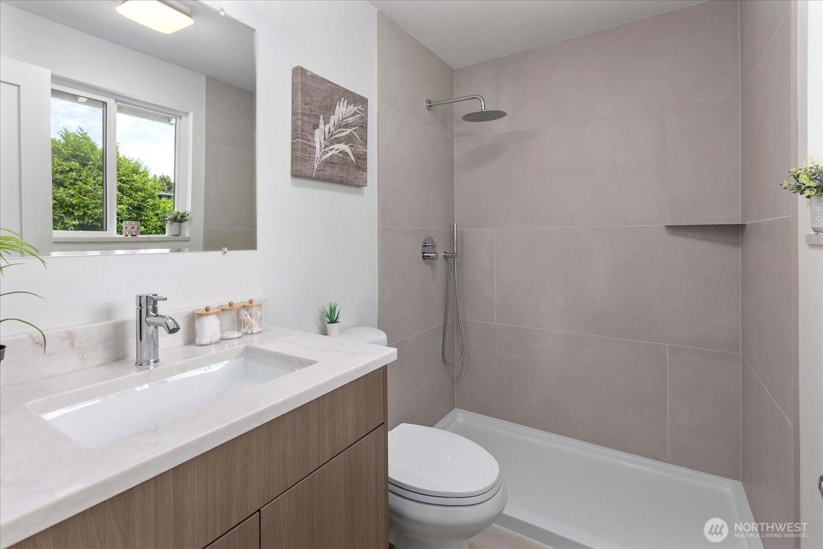 10646 Southeast 236th Street Kent, WA 98031 - Photo 12 of 20 a bathroom with a sink a toilet and a window
