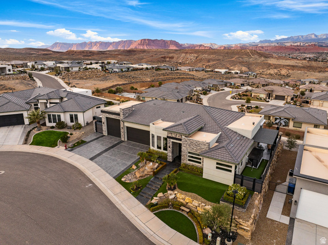 3022 West Sesia Way St. George, UT 84770 - Photo 15 of 52 Aerial view of residential area featuring a mountain backdrop