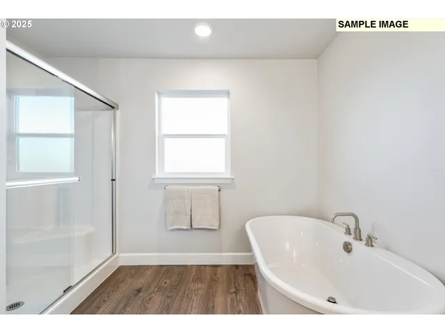 a bathroom with a sink a mirror and a bathtub