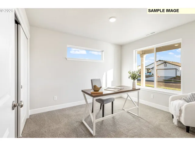 a dining room with a table and chairs