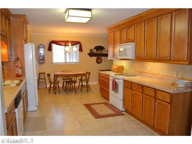 1809 Dantzler Road High Point, NC 27265 - Photo 5 of 16 Breakfast. The kitchen leads to the breakfast area... the perfect place to enjoy your morning cup of coffee or a quick meal!