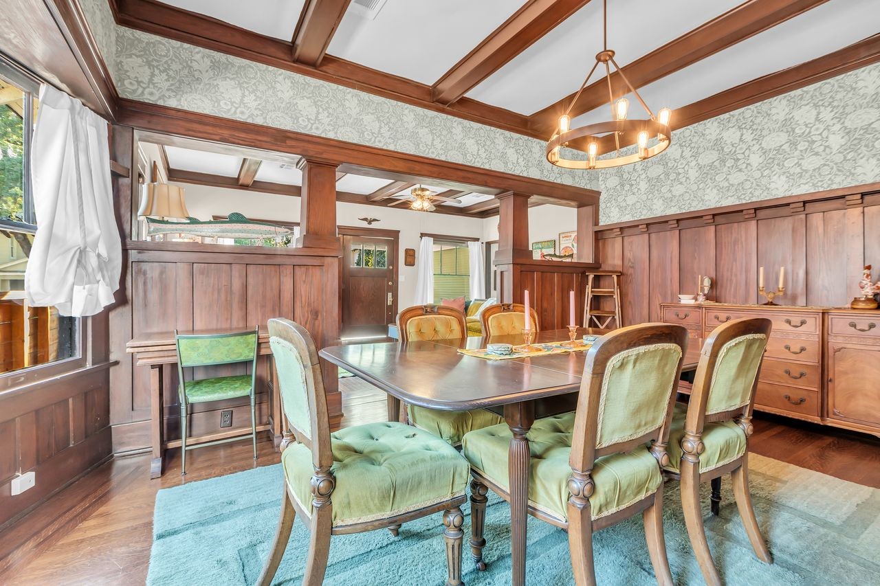 2608 Hopkins Street Houston, TX 77006 - Photo 12 of 42 a dining room with furniture a rug and wooden floor