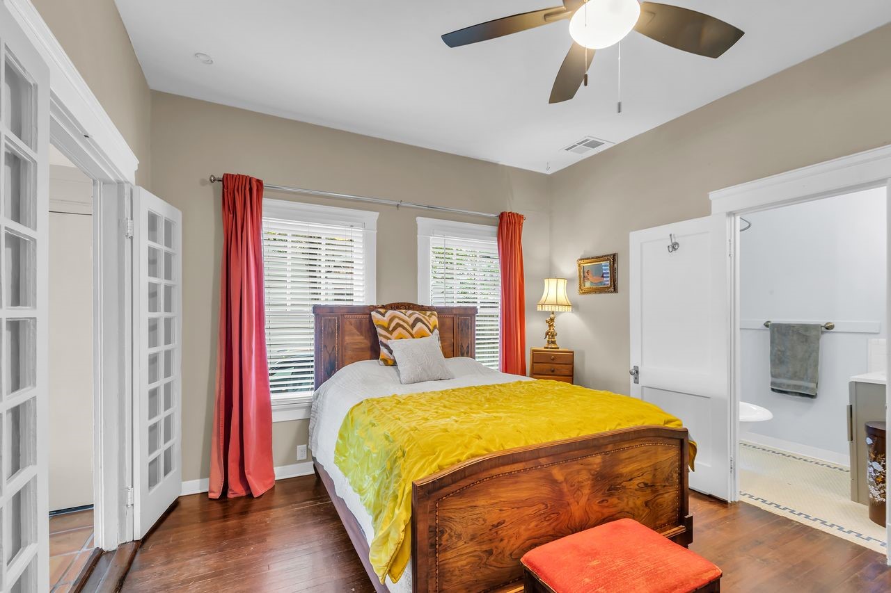 2608 Hopkins Street Houston, TX 77006 - Photo 18 of 42 a bedroom with a bed dresser and a window