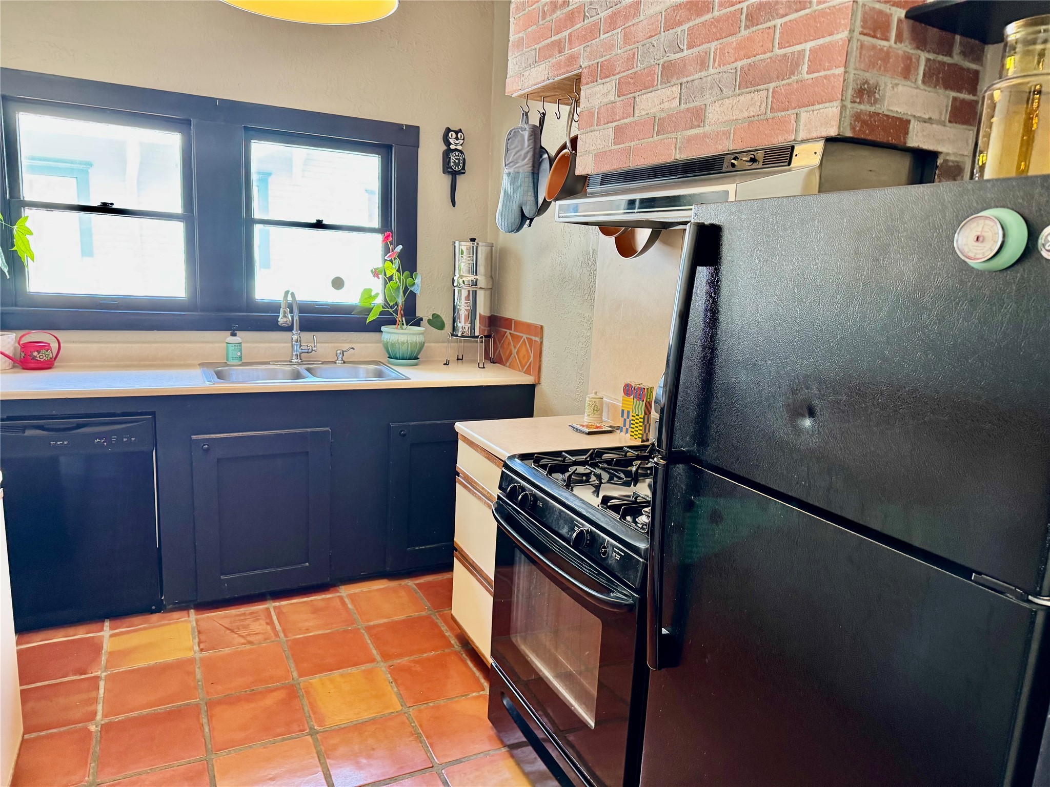 2608 Hopkins Street Houston, TX 77006 - Photo 21 of 42 a kitchen with stainless steel appliances granite countertop a stove a sink and a refrigerator