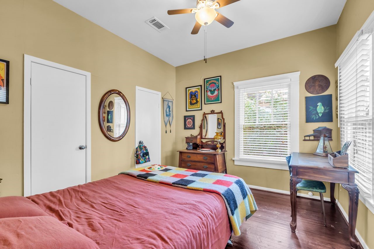 2608 Hopkins Street Houston, TX 77006 - Photo 25 of 42 a bedroom with a bed dresser and a window