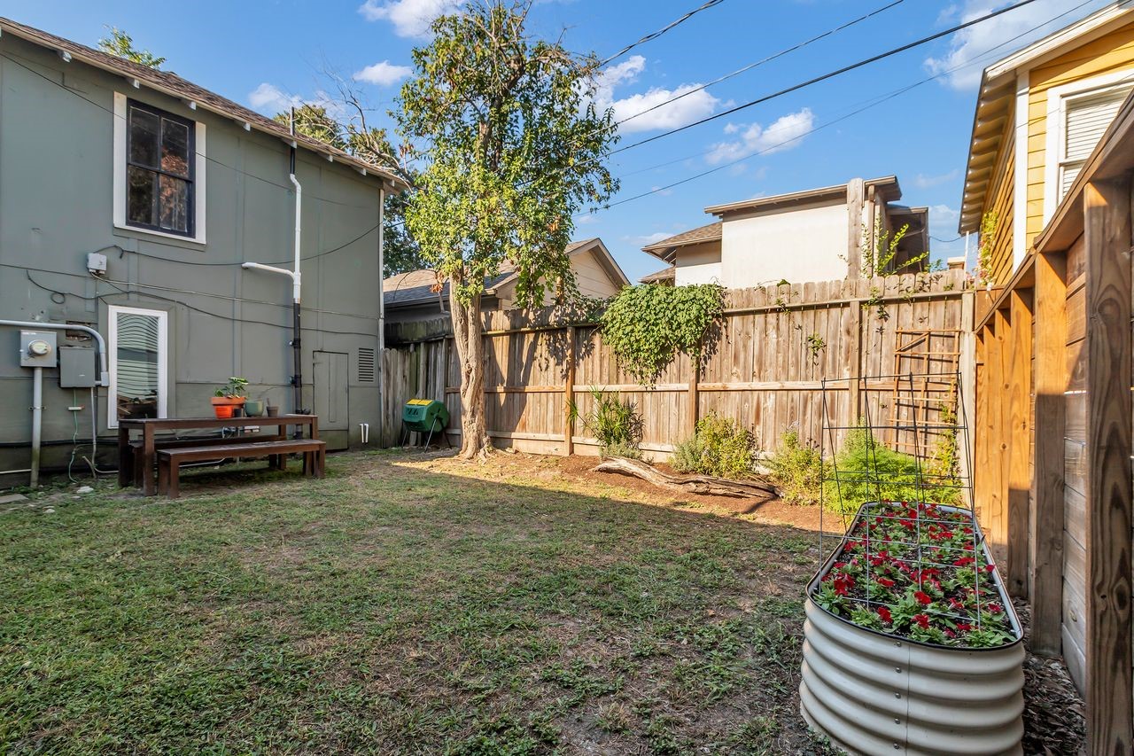 2608 Hopkins Street Houston, TX 77006 - Photo 28 of 42 a view of a chair and table in backyard of the house