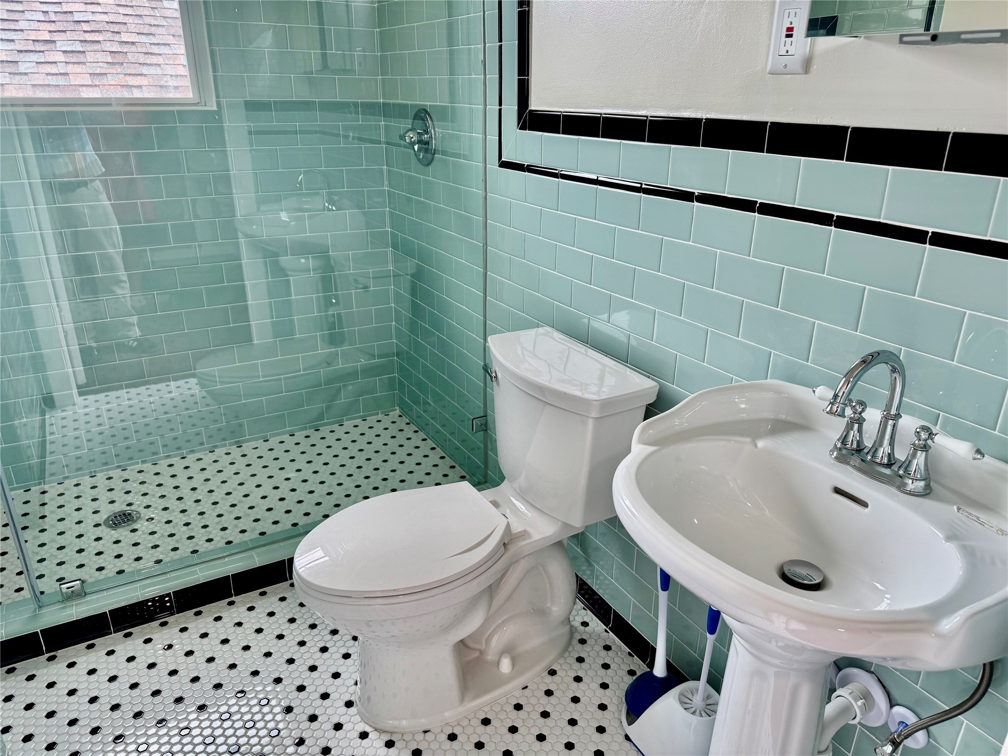 2608 Hopkins Street Houston, TX 77006 - Photo 33 of 42 a bathroom with a sink a toilet and shower