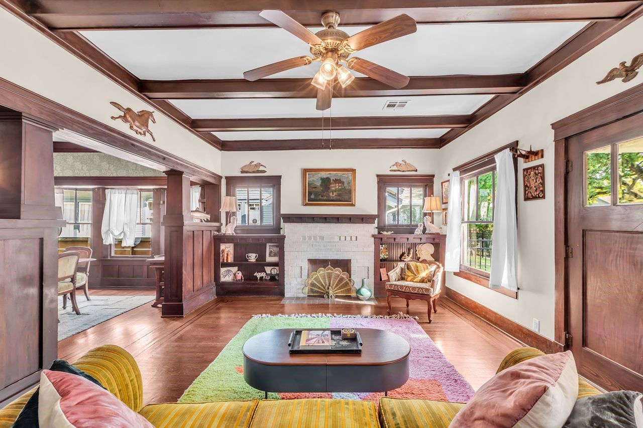 2608 Hopkins Street Houston, TX 77006 - Photo 5 of 42 a living room with fireplace furniture and a large window