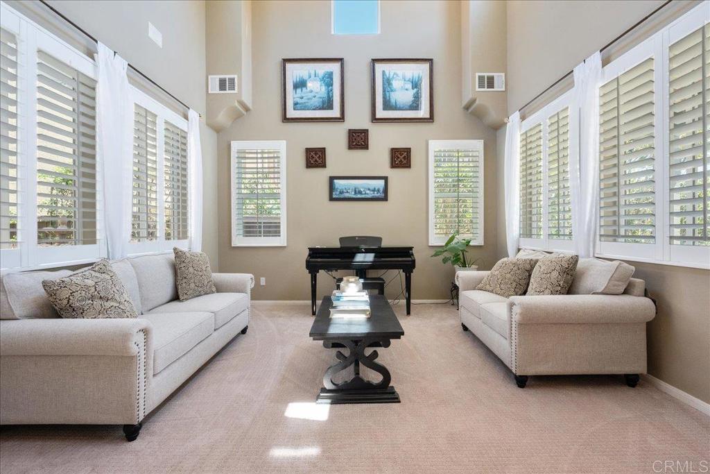 2667 Fallsview Road San Marcos, CA 92078 - Photo 11 of 54 a living room with furniture and a large window