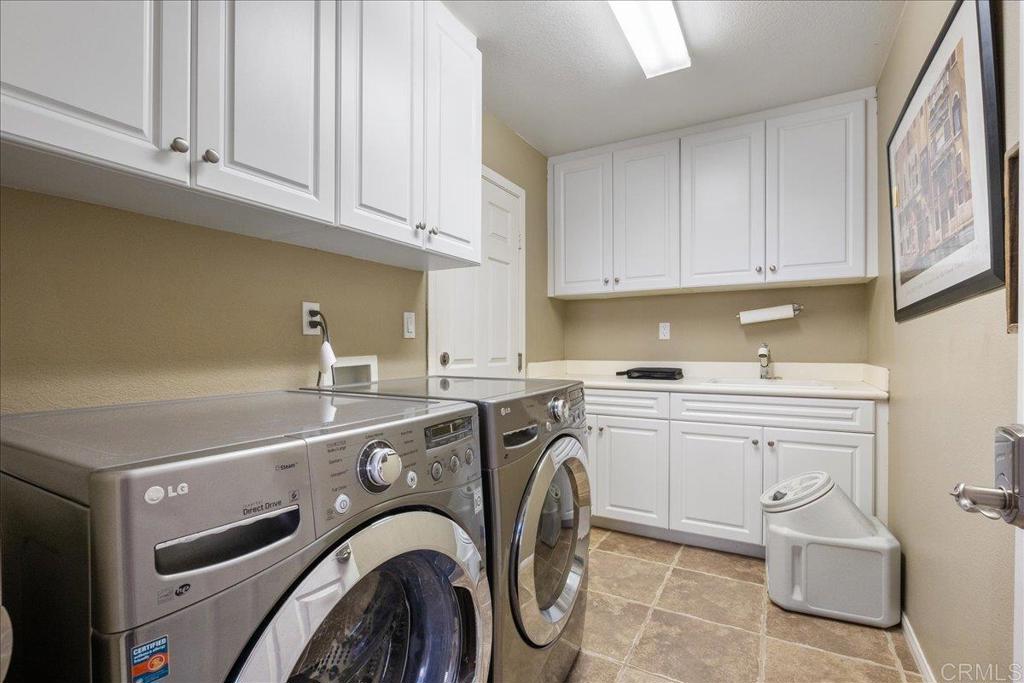2667 Fallsview Road San Marcos, CA 92078 - Photo 14 of 54 a kitchen with stainless steel appliances granite countertop a sink and cabinets