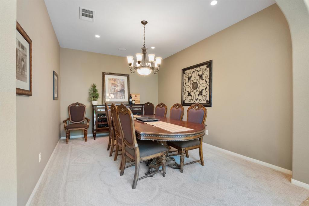 2667 Fallsview Road San Marcos, CA 92078 - Photo 15 of 54 a view of a dining room with furniture and chandelier
