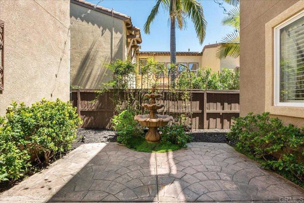 2667 Fallsview Road San Marcos, CA 92078 - Photo 17 of 54 a potted plant sitting in front of a house