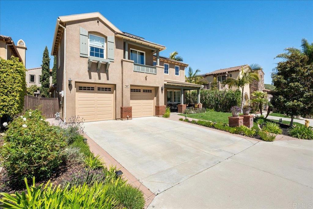 2667 Fallsview Road San Marcos, CA 92078 - Photo 2 of 54 a front view of a house with a yard and potted plants