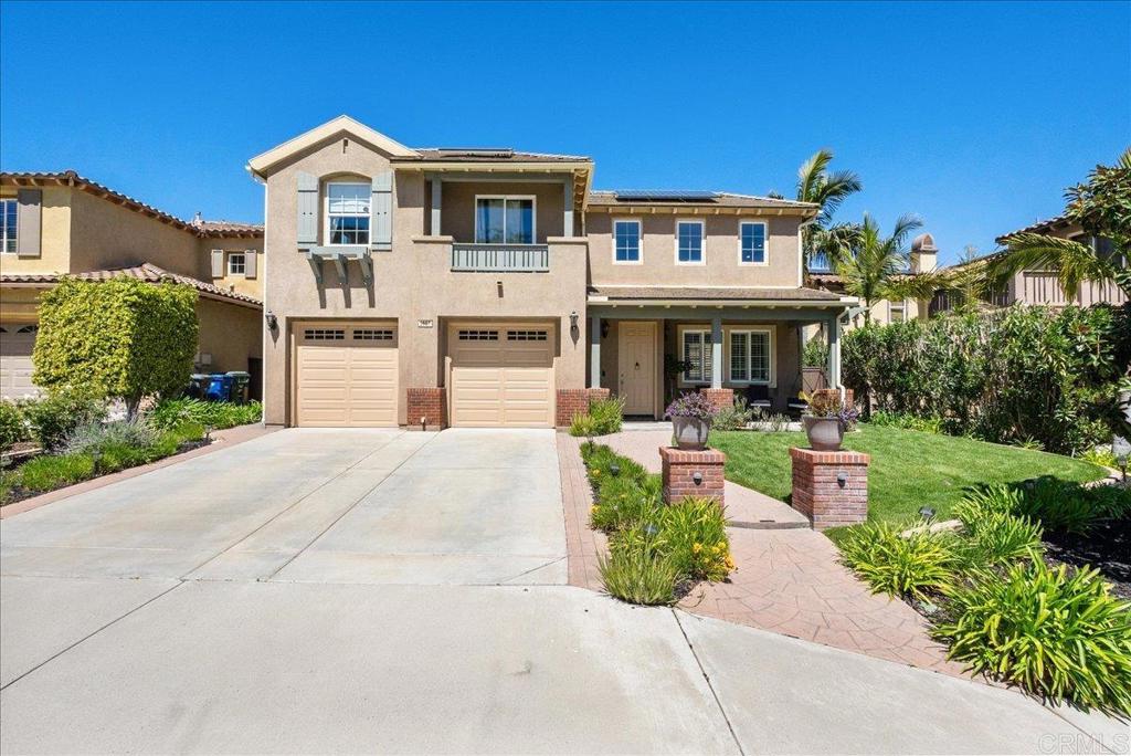 2667 Fallsview Road San Marcos, CA 92078 - Photo 3 of 54 a front view of a house with a yard and potted plants
