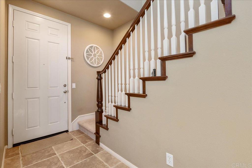2667 Fallsview Road San Marcos, CA 92078 - Photo 33 of 54 a view of staircase with wooden floor and a rug