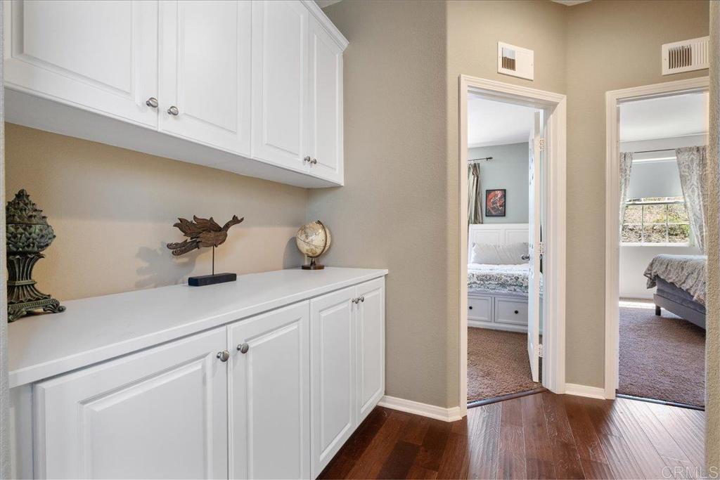 2667 Fallsview Road San Marcos, CA 92078 - Photo 36 of 54 a view of cabinets a wooden floor and a window