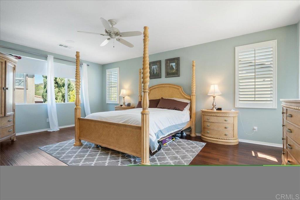 2667 Fallsview Road San Marcos, CA 92078 - Photo 40 of 54 a bedroom with a bed and wooden floor