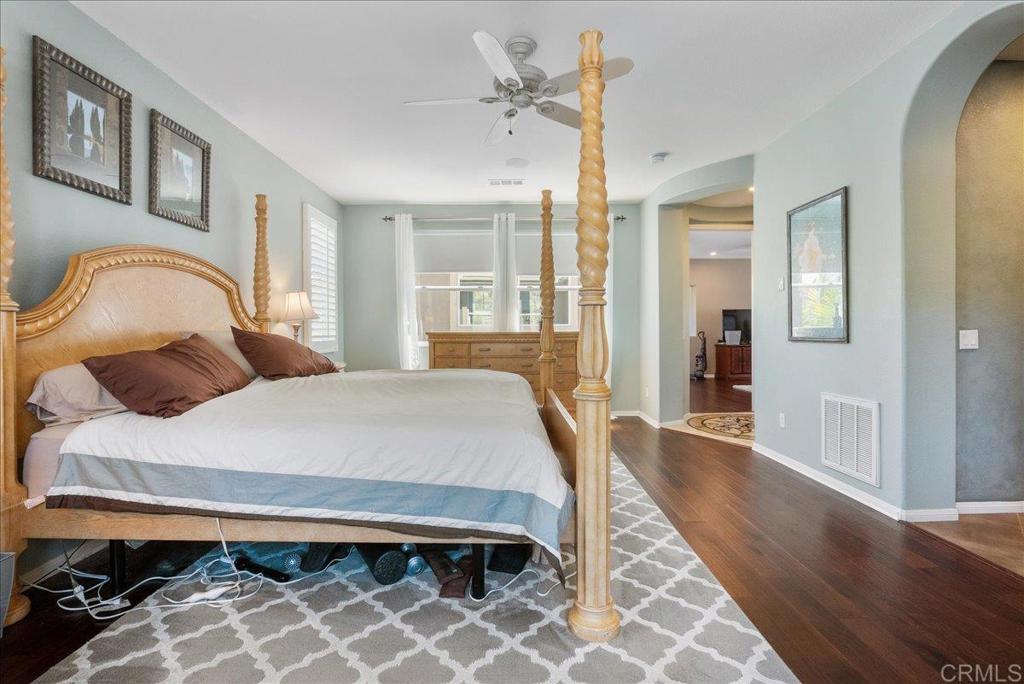 2667 Fallsview Road San Marcos, CA 92078 - Photo 41 of 54 a bedroom with a bed closet and a mirror