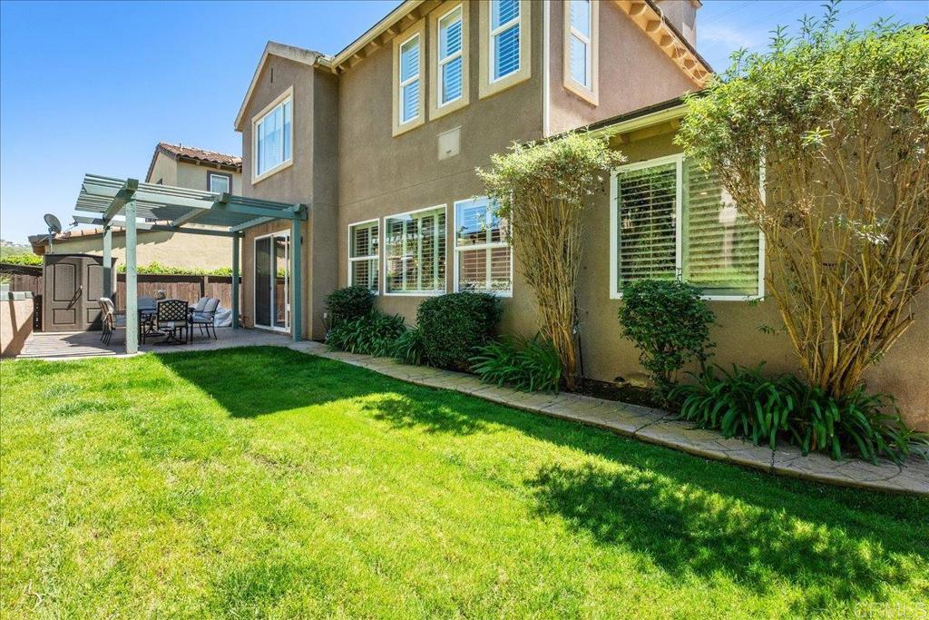 2667 Fallsview Road San Marcos, CA 92078 - Photo 50 of 54 a view of a house with a yard and plants