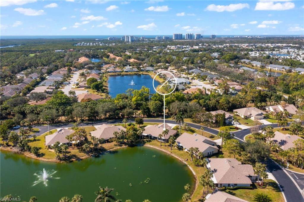 1320 Park Lake Drive Naples, FL 34110 - Photo 1 of 1 an aerial view of residential houses with outdoor space