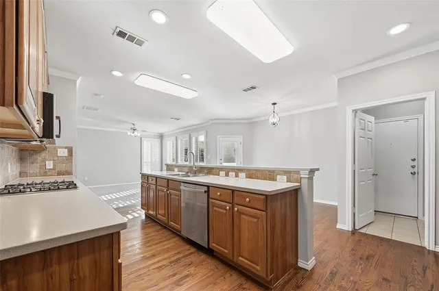a kitchen with a sink and a refrigerator