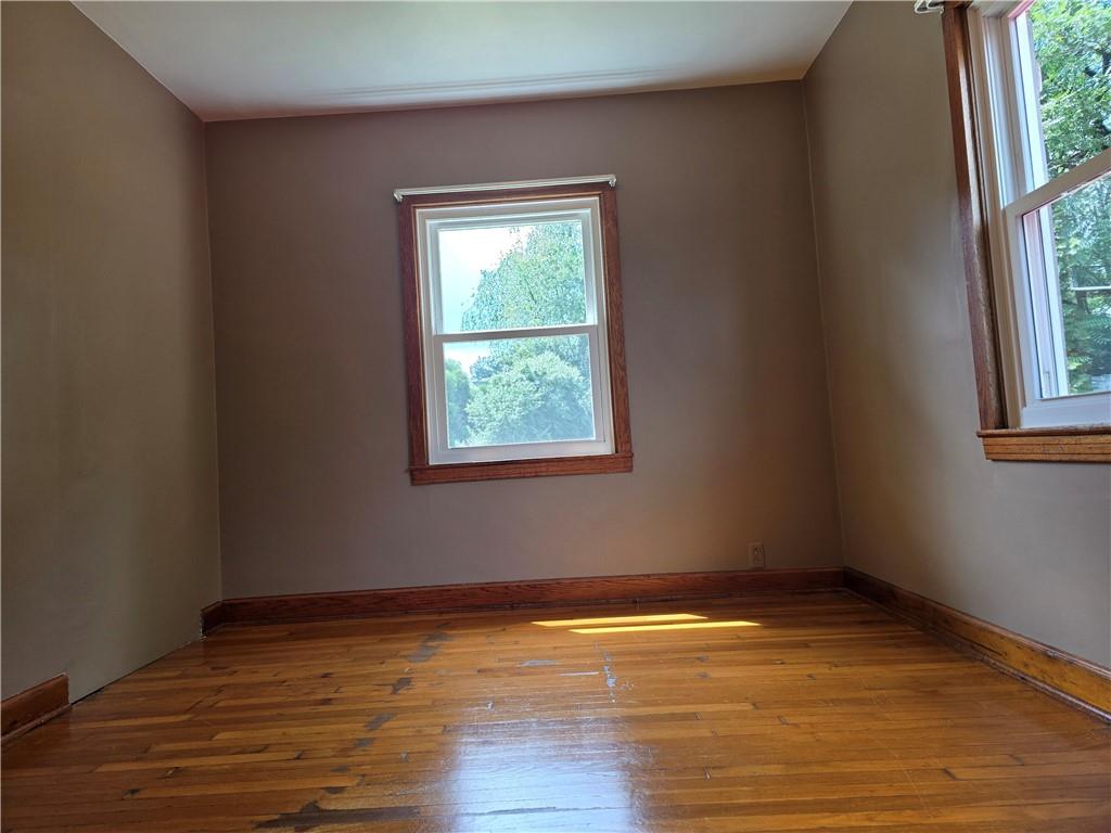 368 Pittsburgh Road Butler, PA 16002 - Photo 15 of 28 an empty room with wooden floor and windows