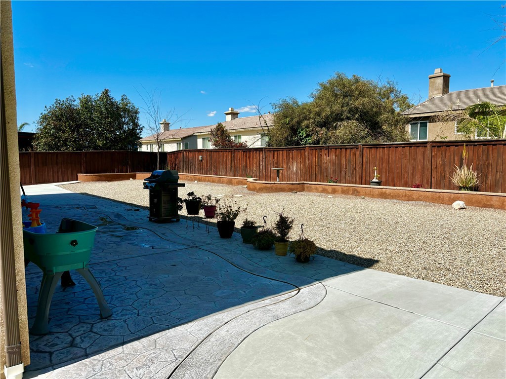 1005 Garrett Way San Jacinto, CA 92583 - Photo 14 of 29 a view of a backyard of the house